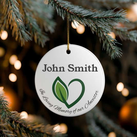 Personalized Christmas ornament with a heart and leaf design, hanging on a tree.