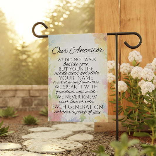 Decorative garden flag with text on a stand outdoors 